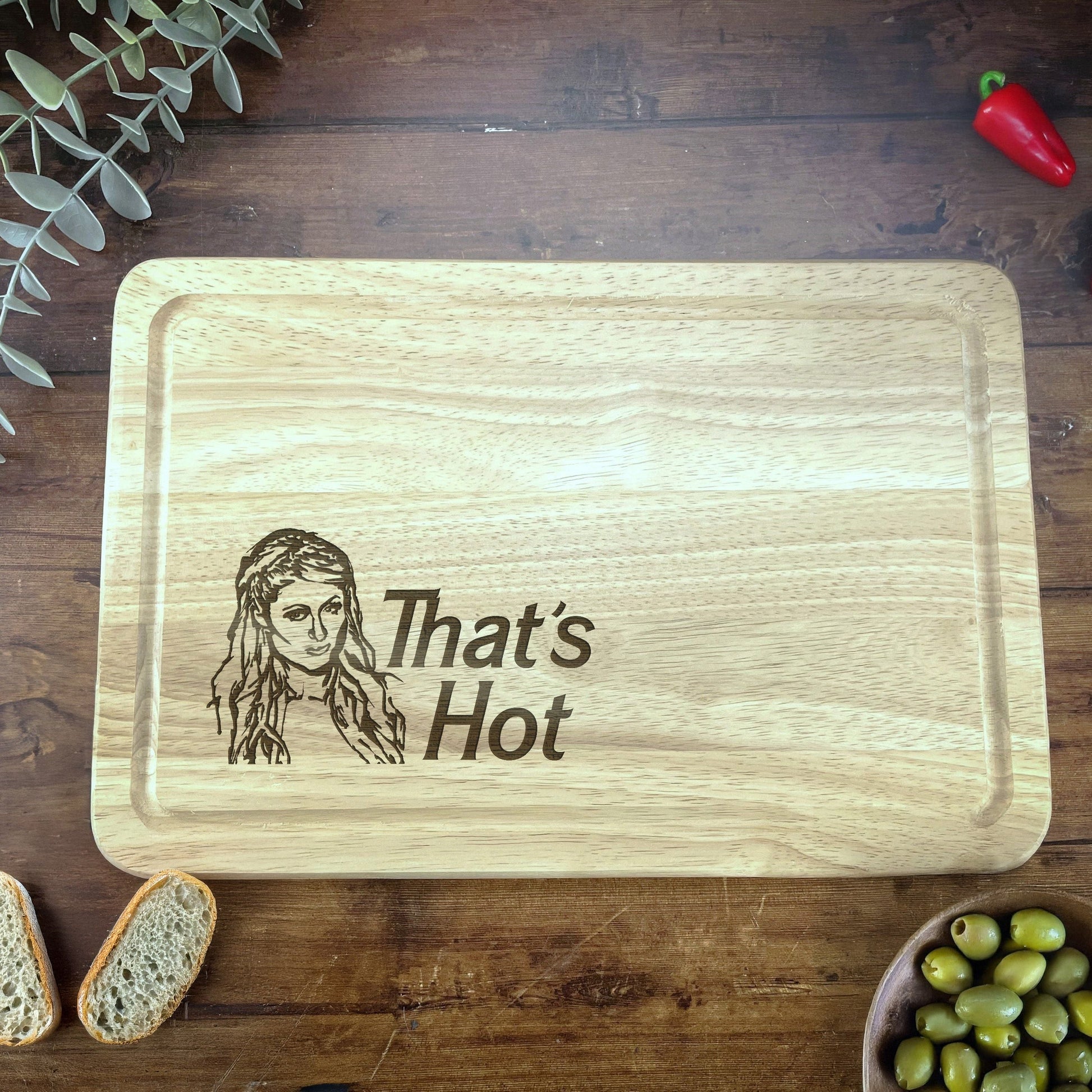 a wooden cutting board with a picture of a woman on it