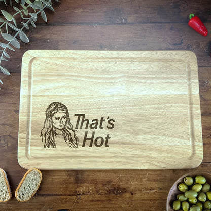 a wooden cutting board with a picture of a woman on it
