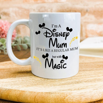 a white coffee mug sitting on top of a wooden table