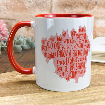 a red and white coffee mug with words on it