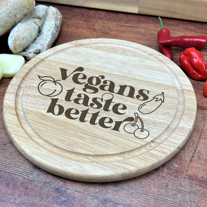a wooden cutting board with the words vegans taste better on it