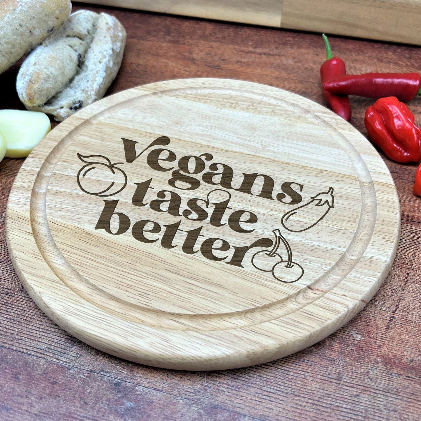 a wooden cutting board with the words vegans taste better on it