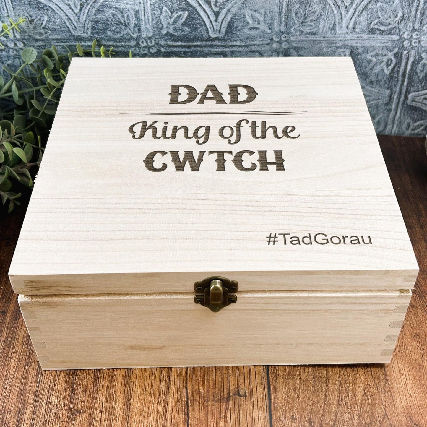 a wooden box sitting on top of a wooden table