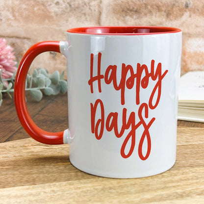 a red and white coffee mug with the words happy days on it