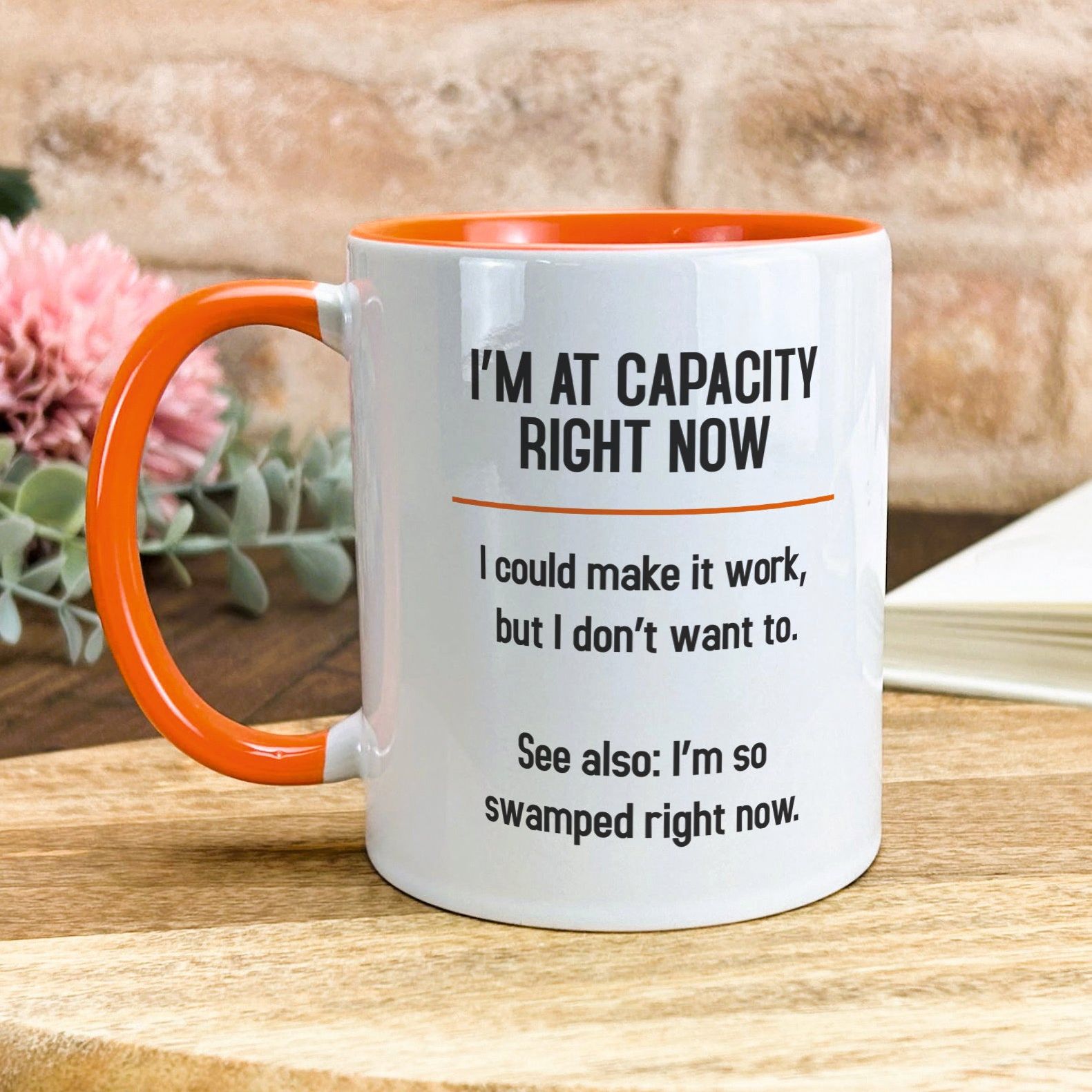 a coffee mug sitting on top of a wooden table