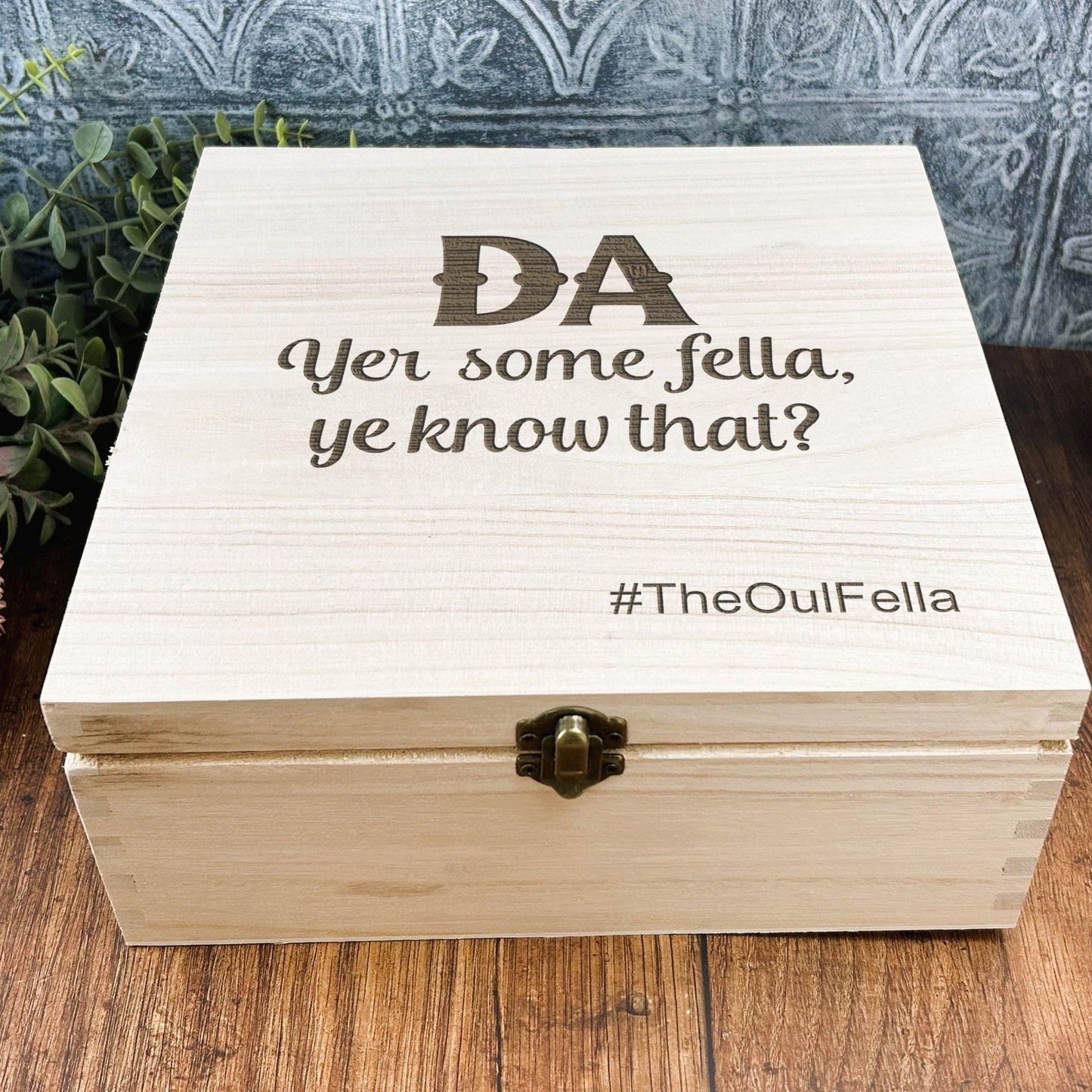 a wooden box sitting on top of a wooden table