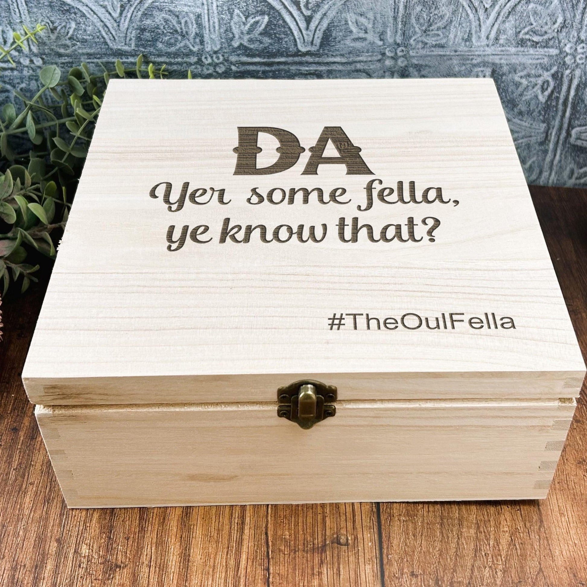 a wooden box sitting on top of a wooden table
