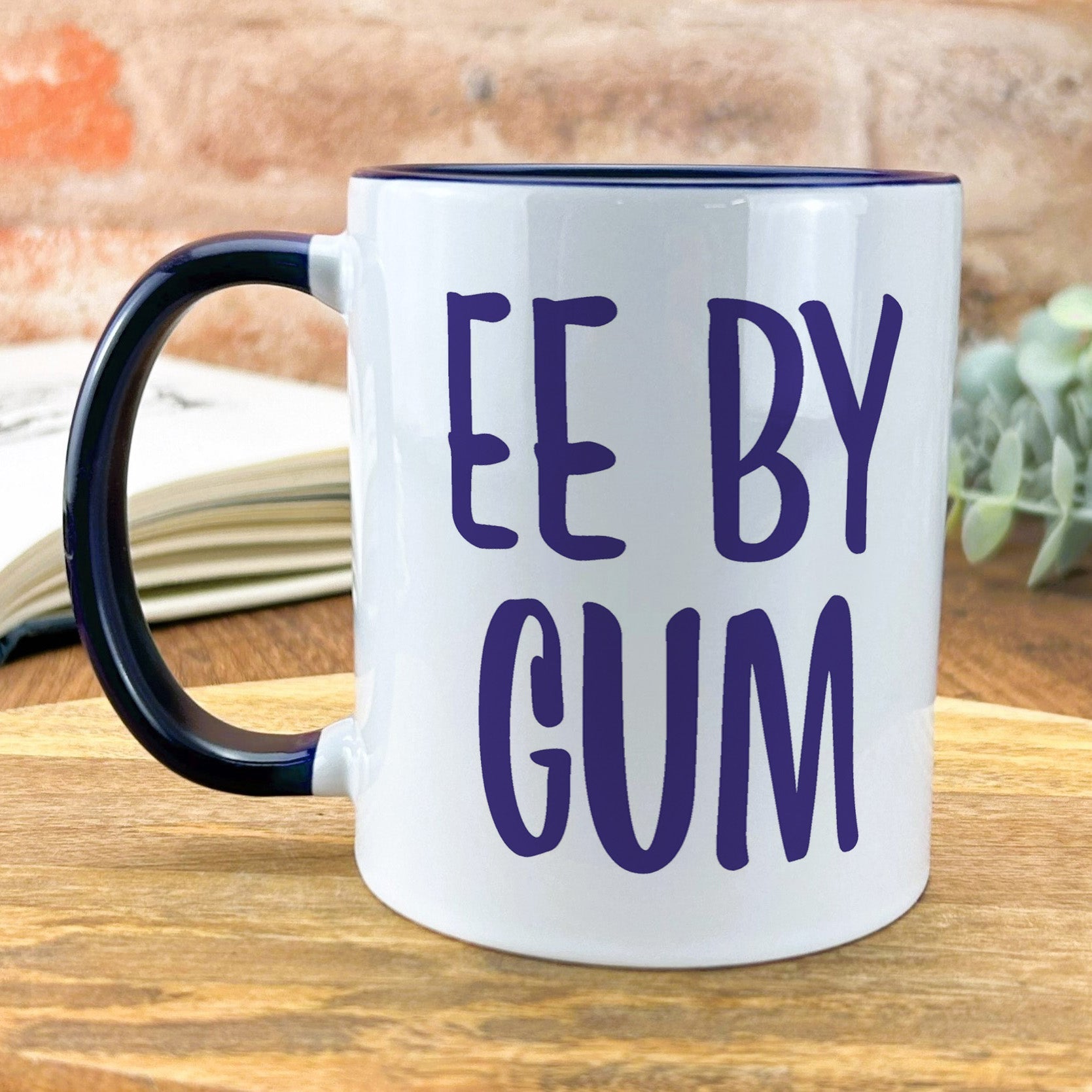 a coffee mug that says ee by gum on it