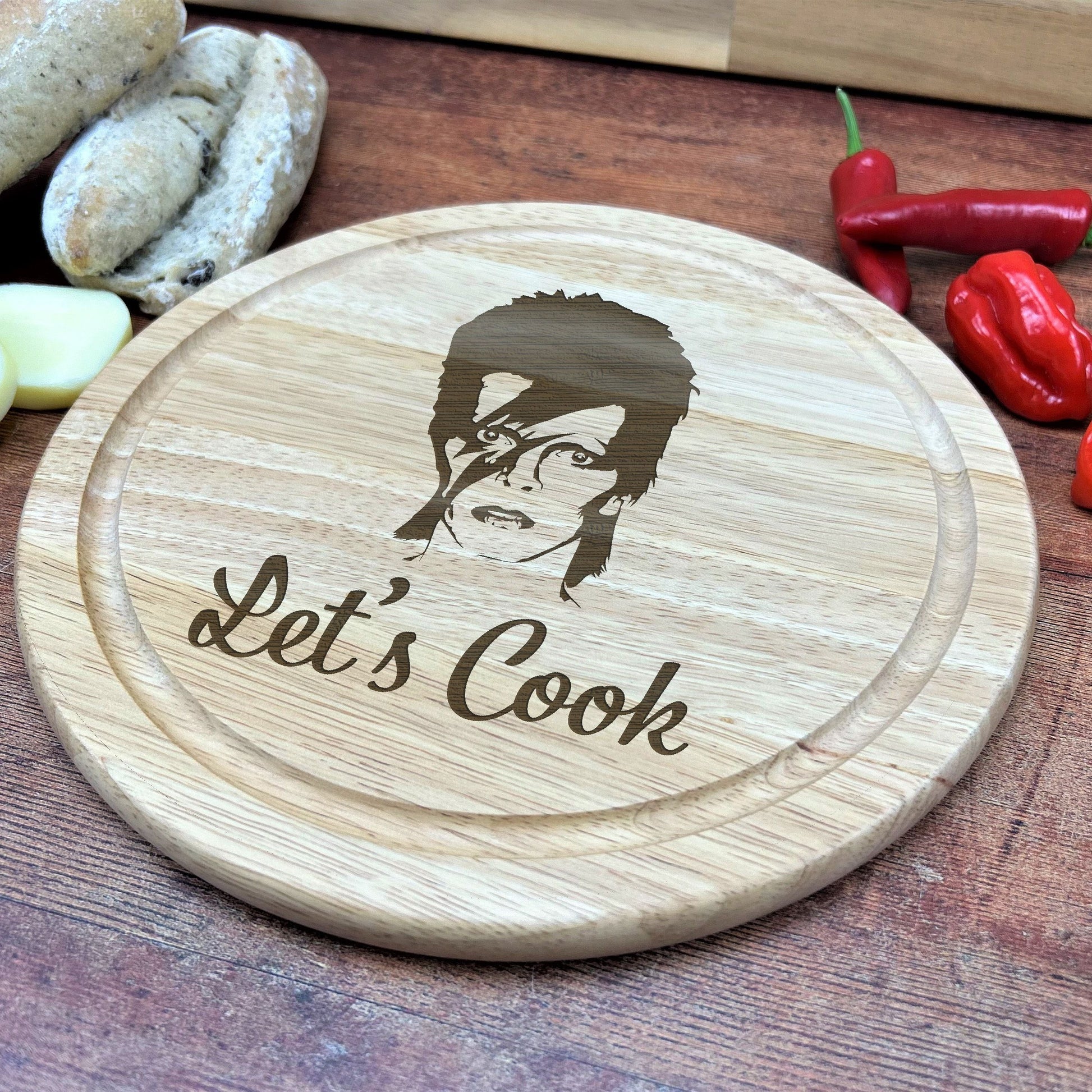 a wooden cutting board with a picture of a man on it