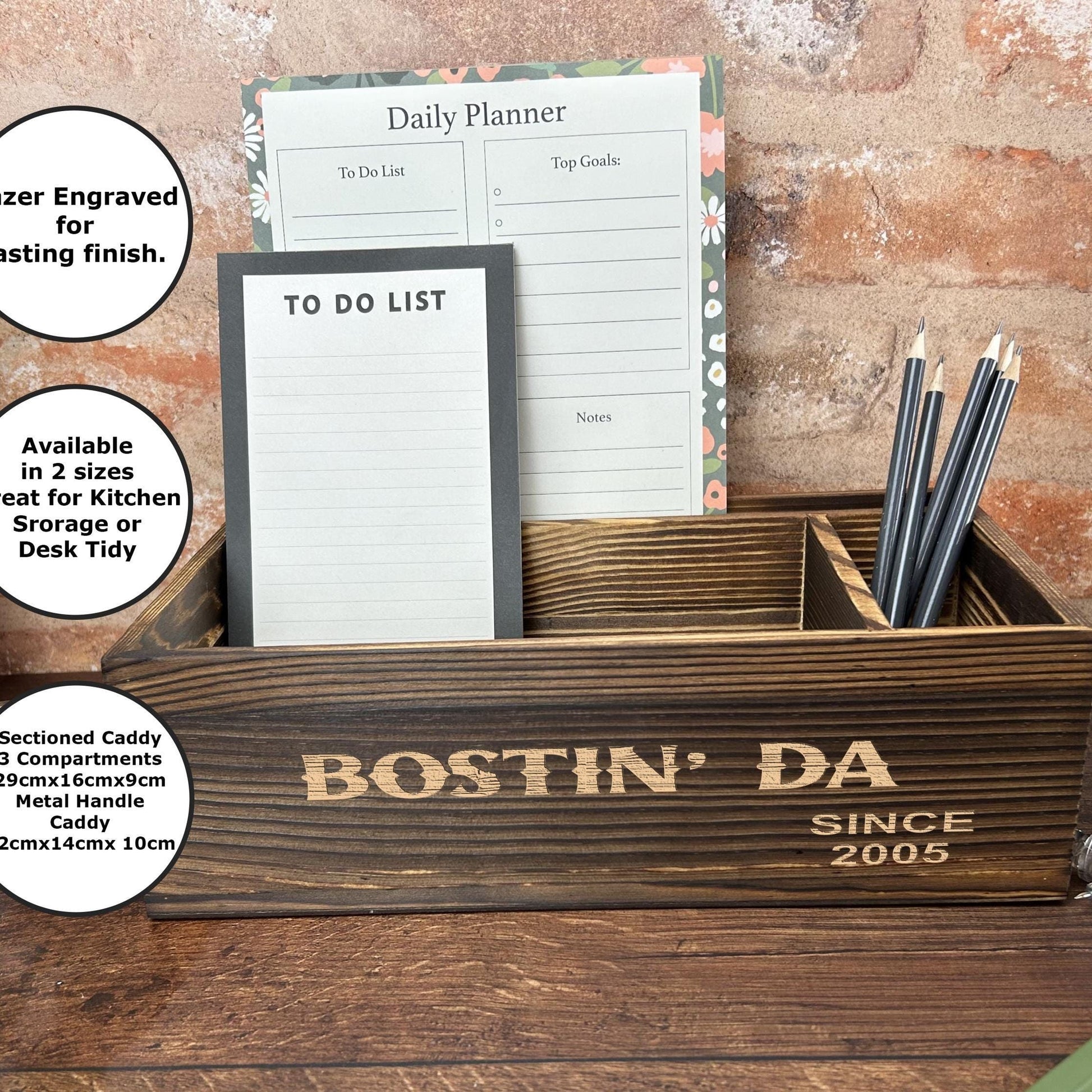 a desk with a wooden box with writing on it