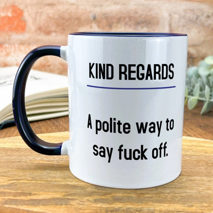 a white and black coffee mug sitting on top of a wooden table