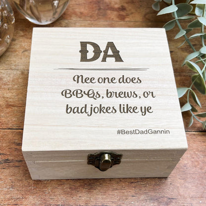 a wooden box sitting on top of a wooden table