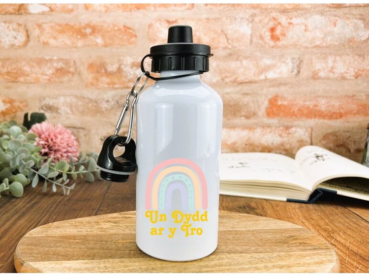 a white water bottle with a rainbow on it