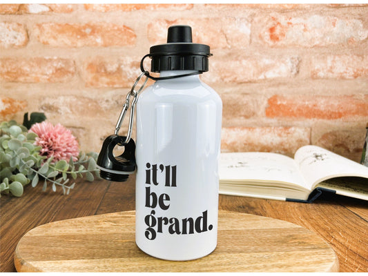 a white water bottle sitting on top of a wooden table