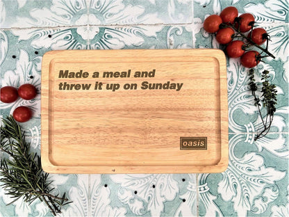 a wooden cutting board that says made a meal and threw it up on sunday