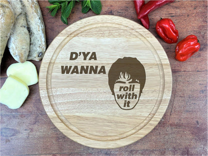 a wooden cutting board with a picture of a woman on it