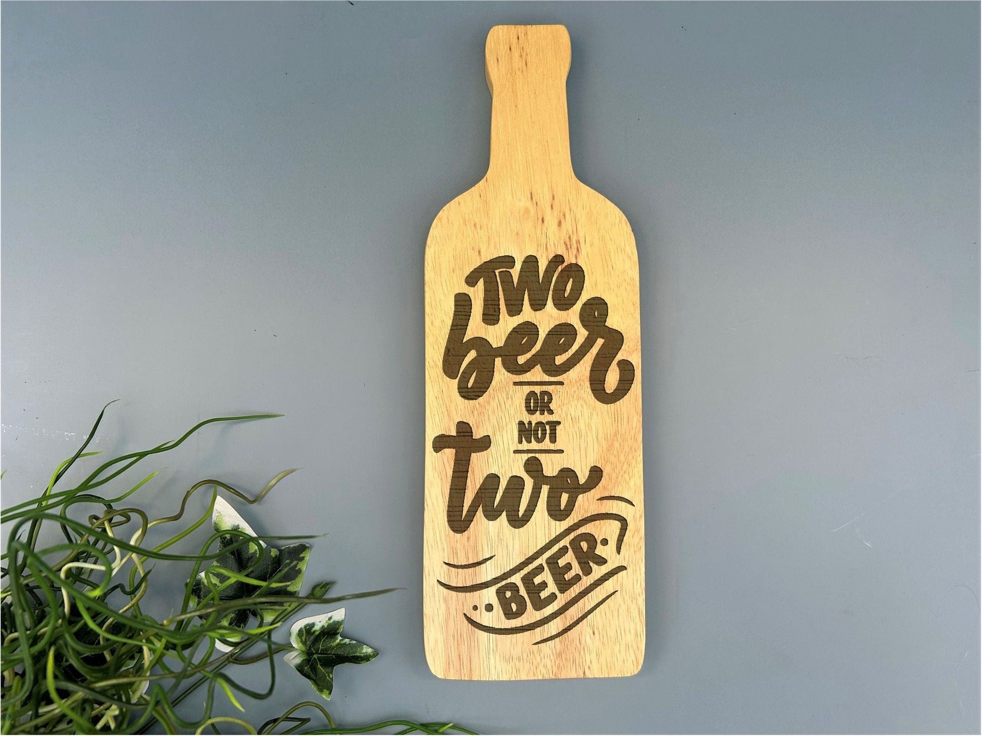 a wooden sign that says two beers or two beer