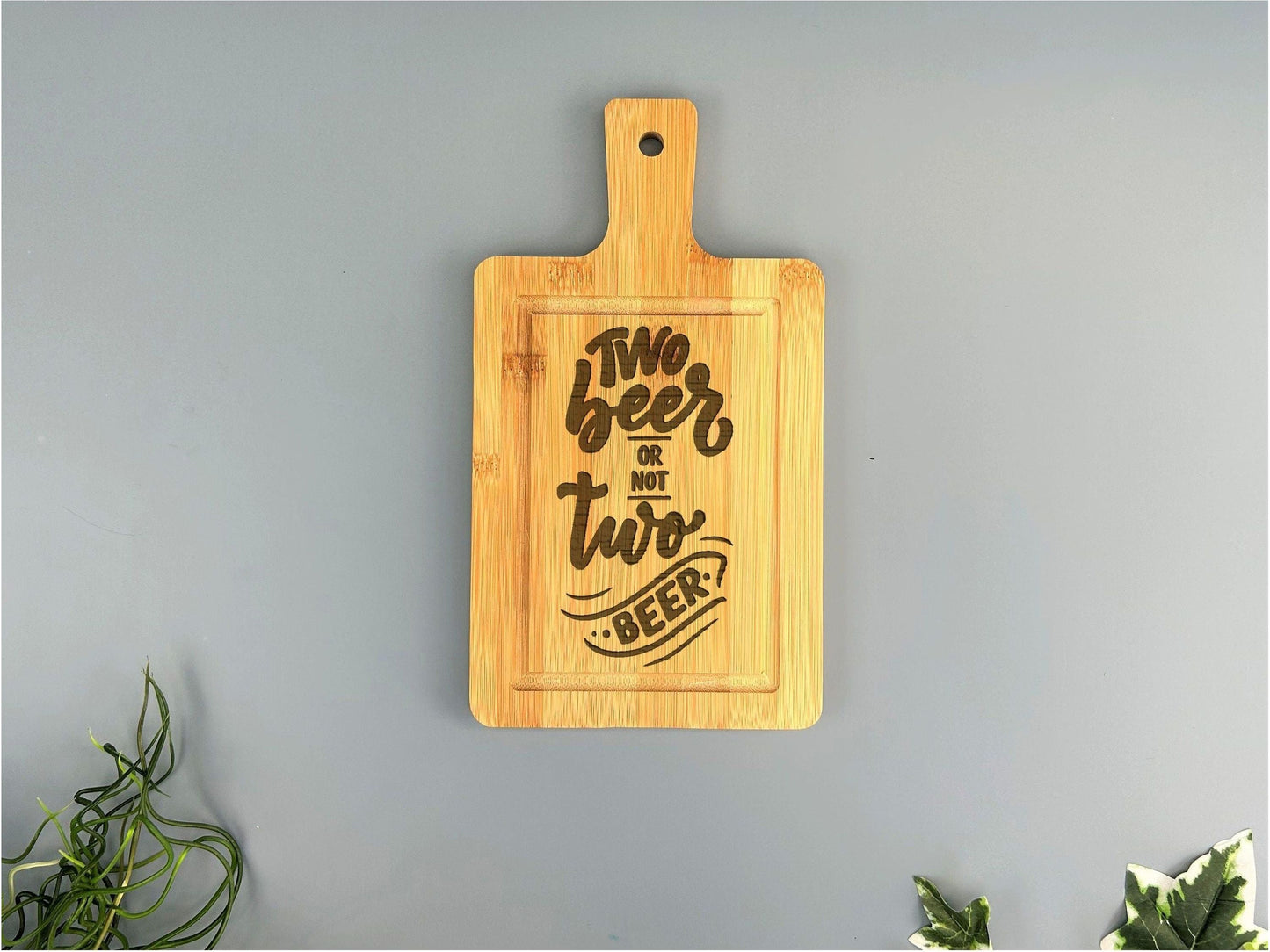 a cutting board that says two beers are two beers