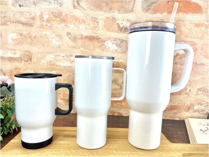 a couple of white cups sitting on top of a wooden table