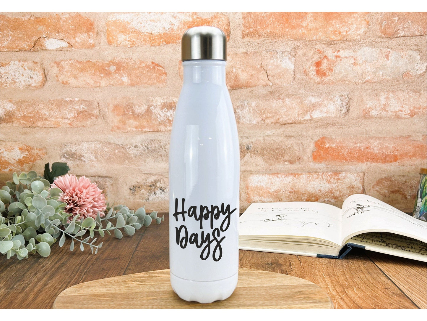 a white water bottle sitting on top of a wooden table