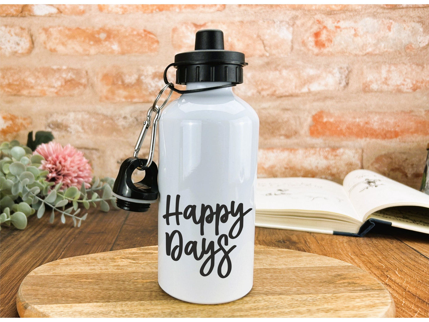 a white water bottle sitting on top of a wooden table