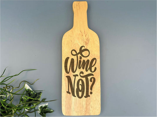 a wooden sign that says wine not hanging on a wall