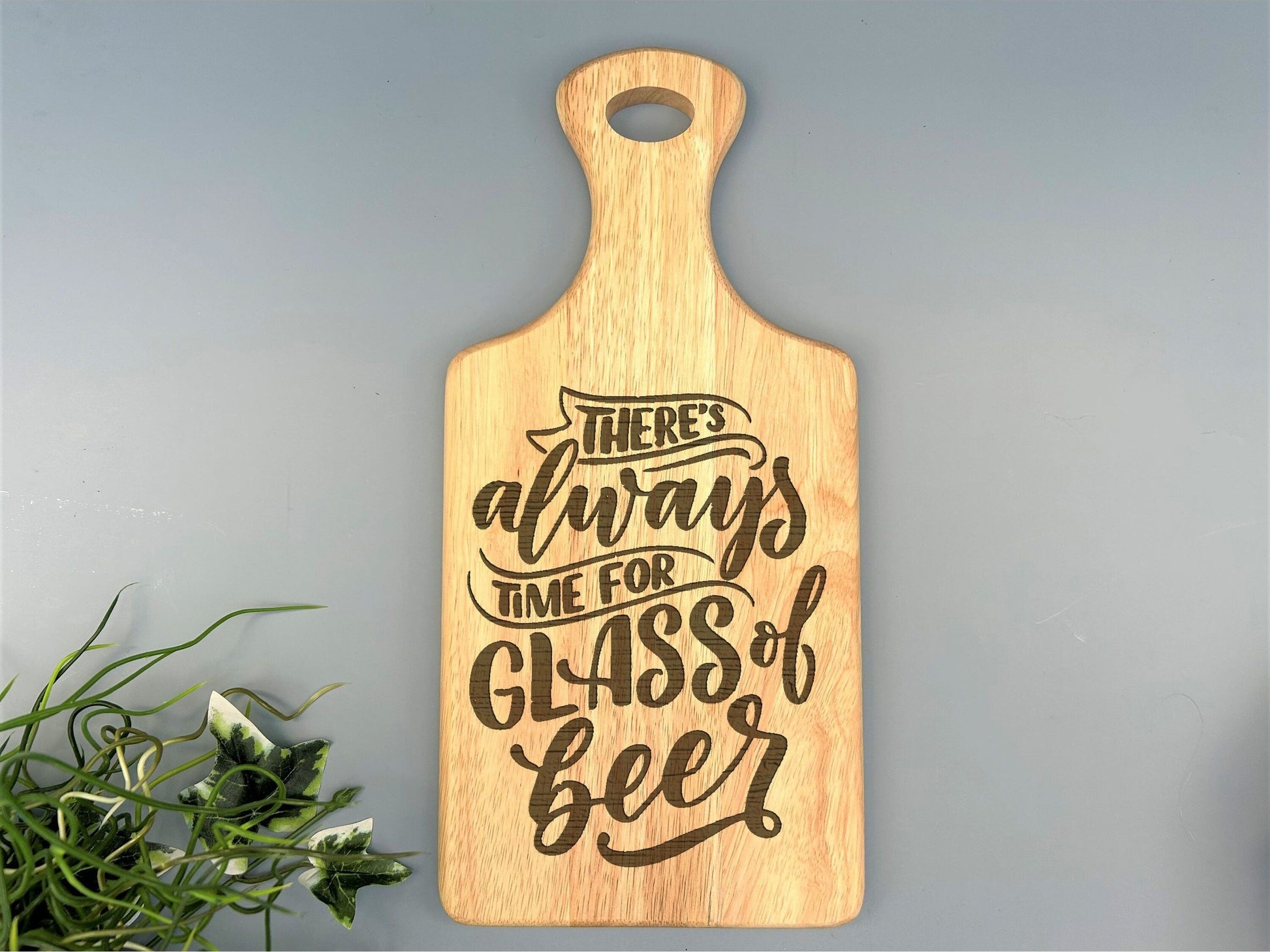 a wooden cutting board that says there&#39;s always time for glass of beer