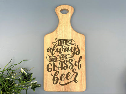 a wooden cutting board that says there&#39;s always time for glass of beer