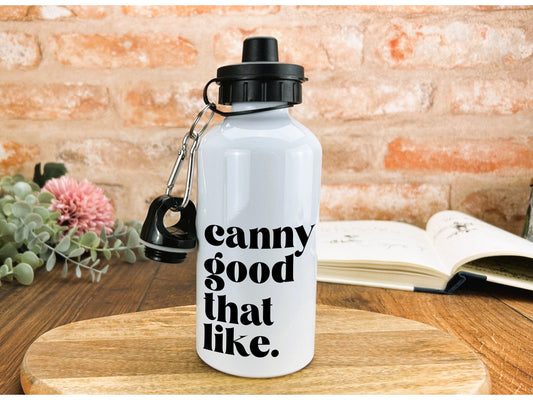 a white water bottle sitting on top of a wooden table