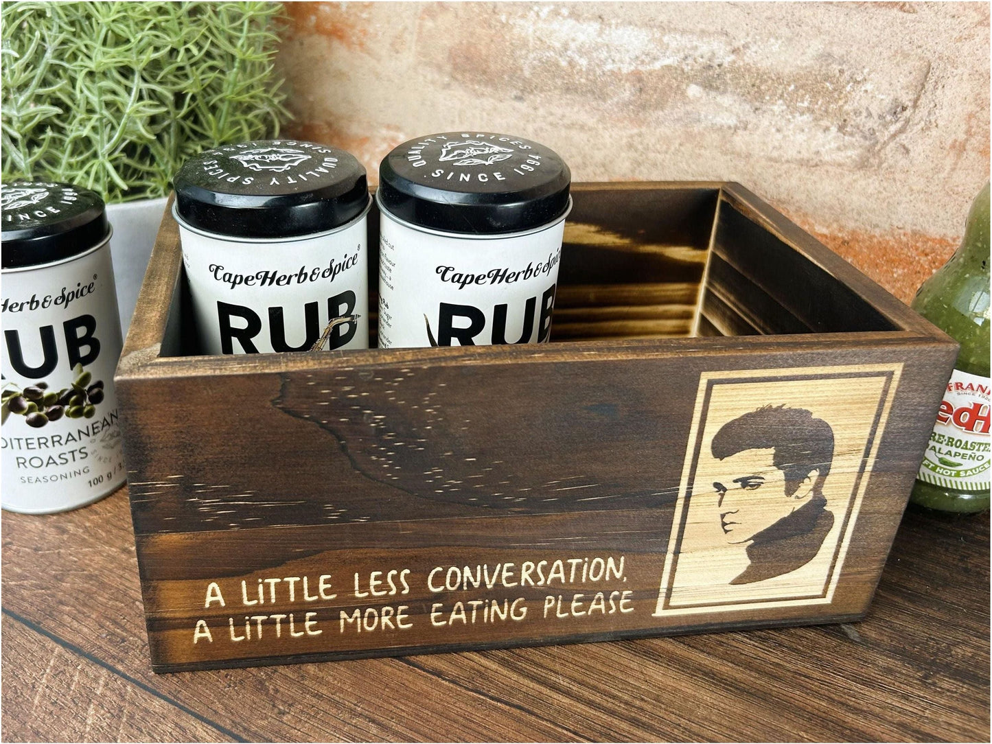 a wooden box filled with three bottles of beer