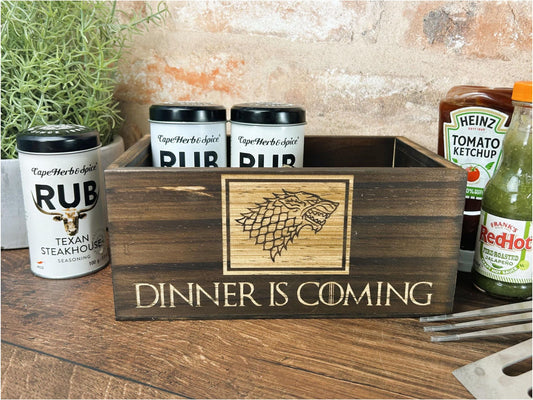 a wooden box with a sign that says dinner is coming