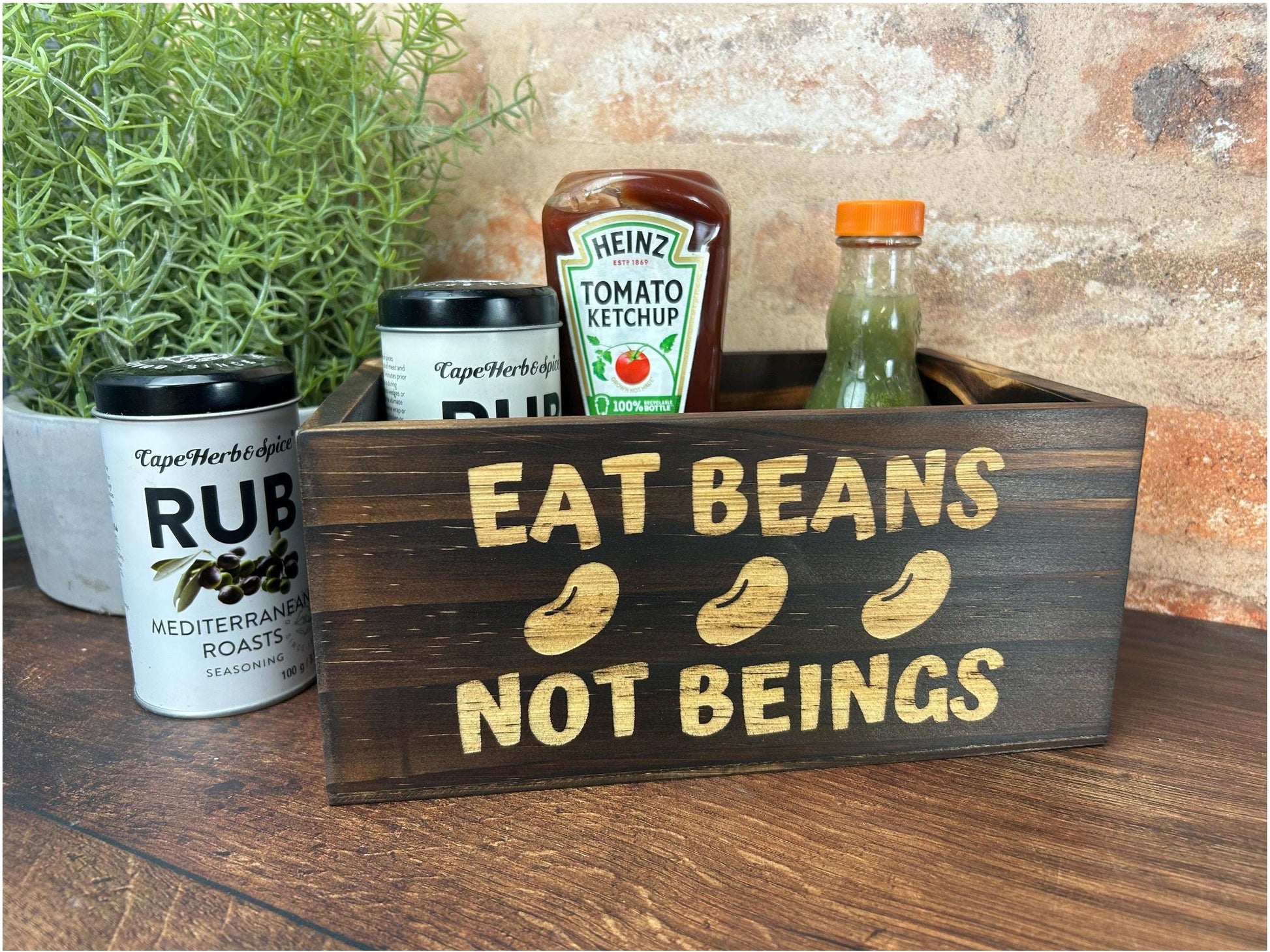 a wooden sign that says eat beans not beings