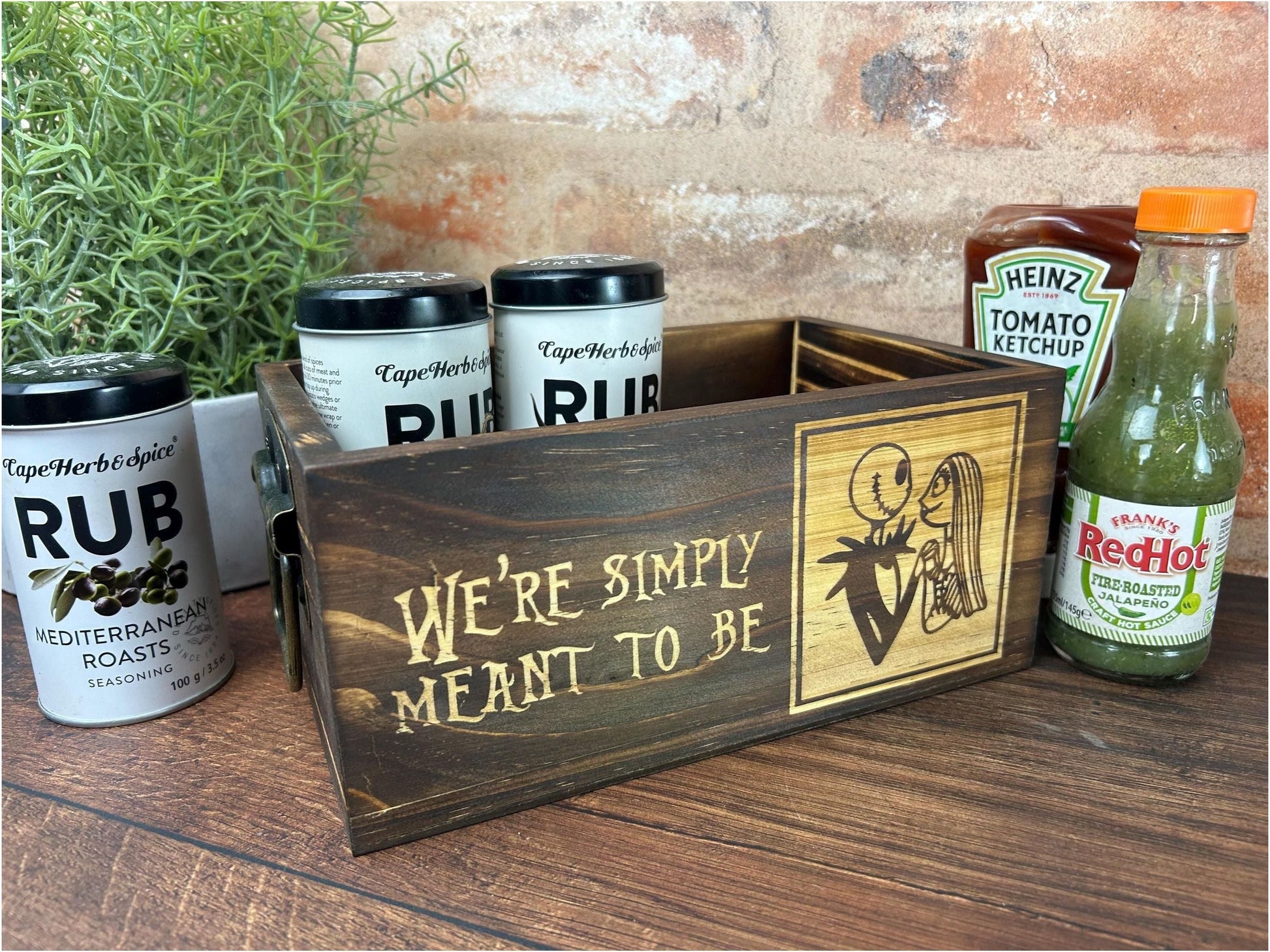 a wooden box with a sign that says, we&#39;re simply meant to be