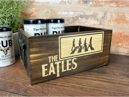 a wooden box with the beatles logo on it