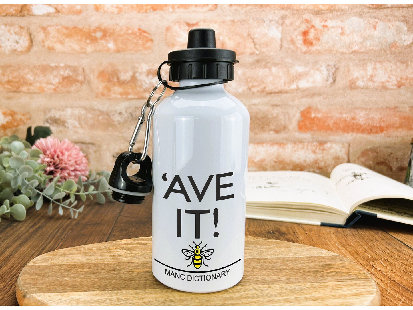 a white water bottle sitting on top of a wooden table