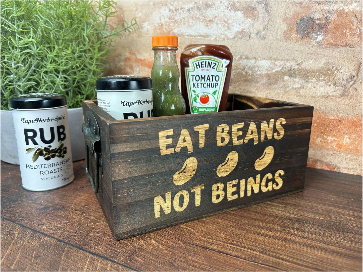 a wooden box with a sign that says eat beans not beings