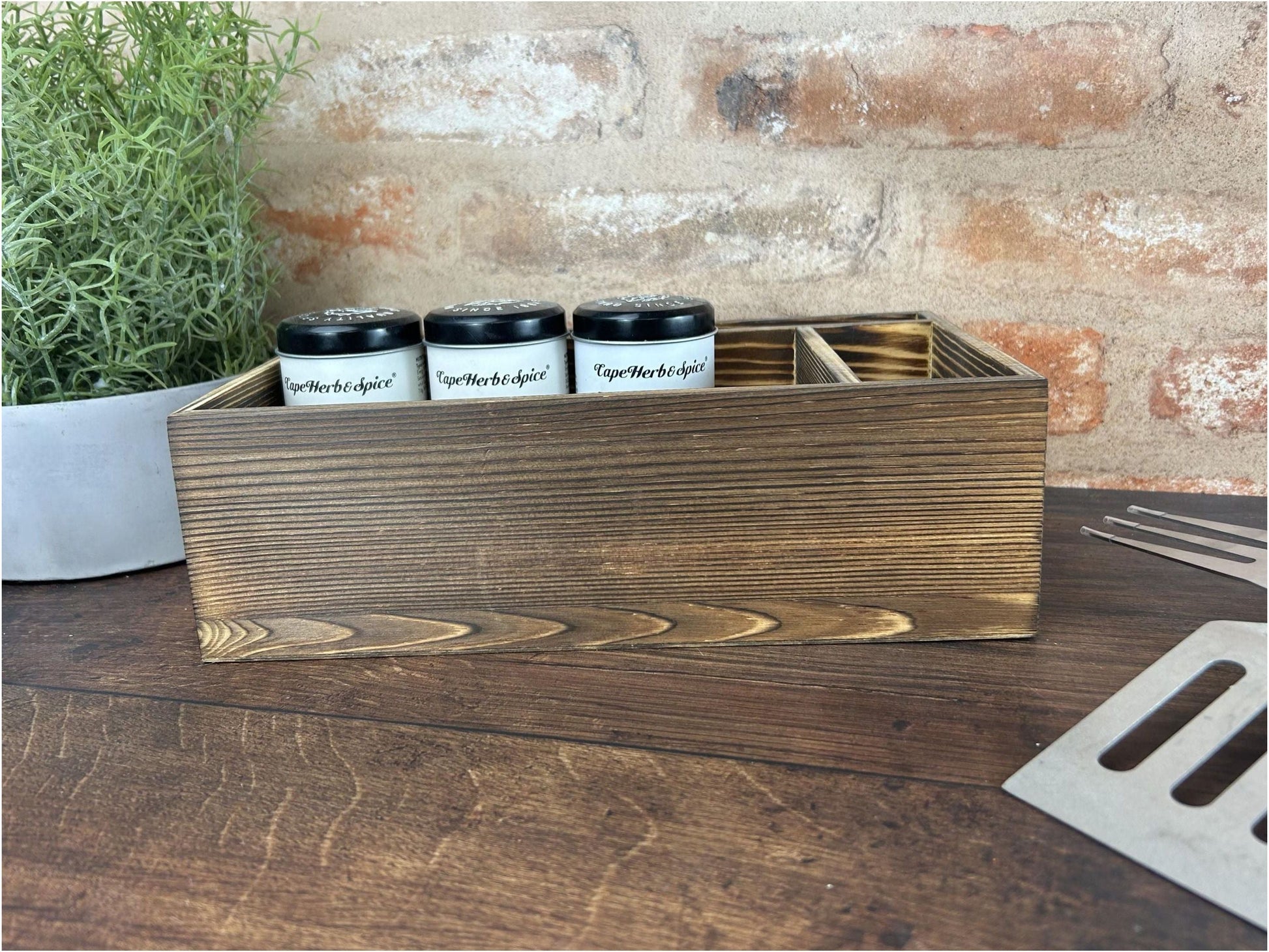 a wooden box filled with three bottles of coffee