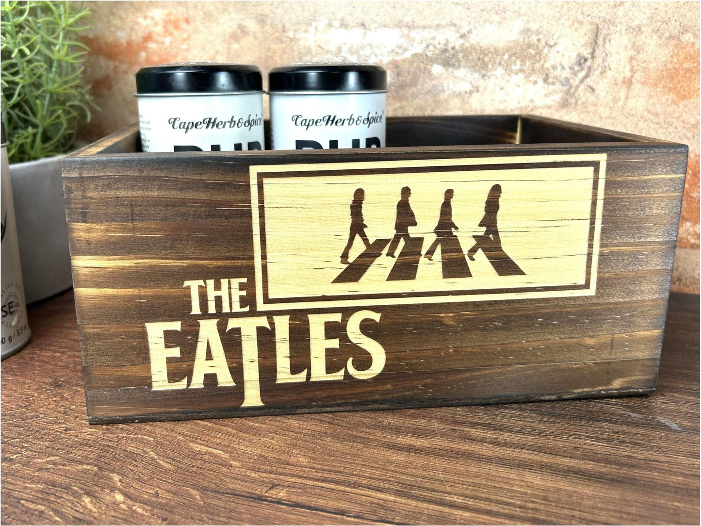 a wooden box with the beatles logo on it